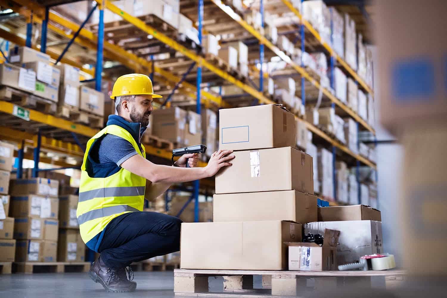 stock-photo-male-warehouse-worker-with-barcode-scanner-773962387